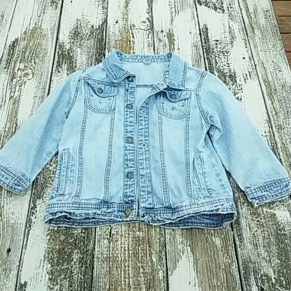 Girls light wash denim jacket.